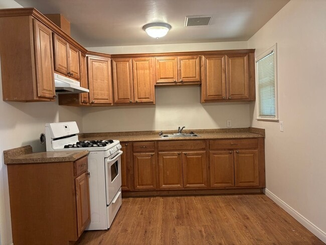 Building Photo - Central North home with big backyard, dual pane windows & more!