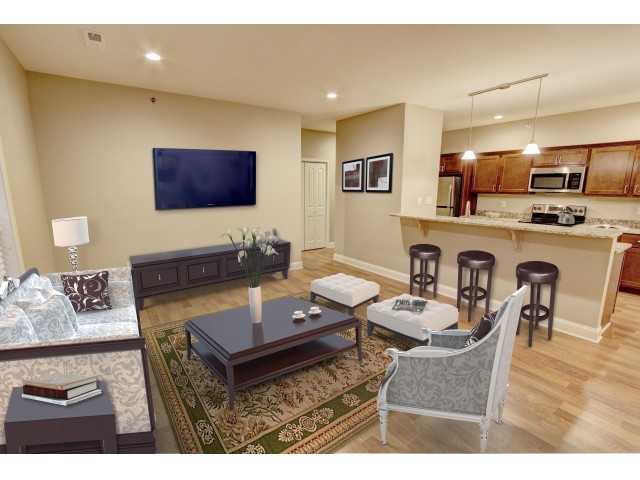 The living room is open to the kitchen - Mill Hollow Apartments