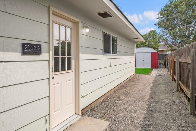 Unit 2 is accessed off the side of the home with it's own private entry & yard space - 2008 Parklane Avenue