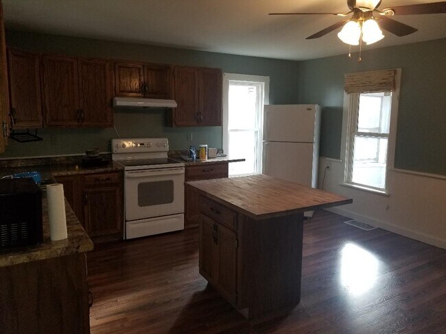 Fridge, oven, and dishwasher stay with unit. - 90 Logan Ave