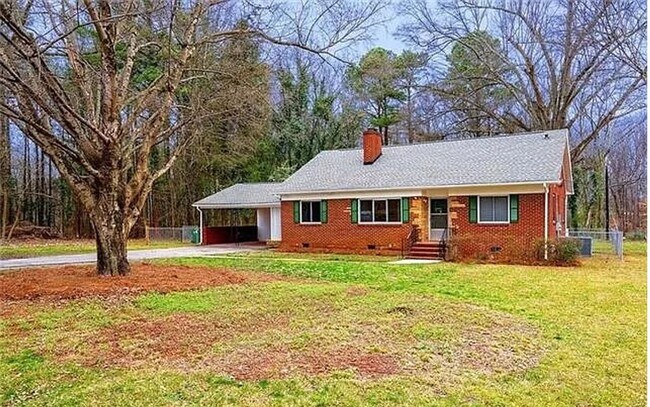 Building Photo - Beautiful full-brick 1-story home set back...