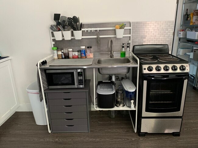 Micro kitchen with sink, oven, stove, microwave and full sized refrigerator & freezer (not pictured) - 3309 Fenelon St