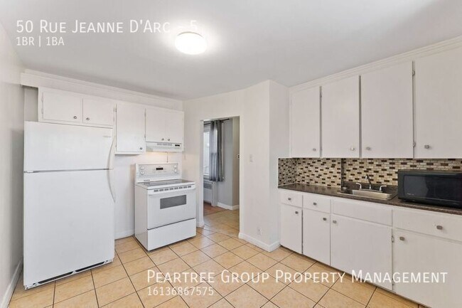 Photo du bâtiment - Joyful Jeanne-D'Arc-1 bed apartment for rent