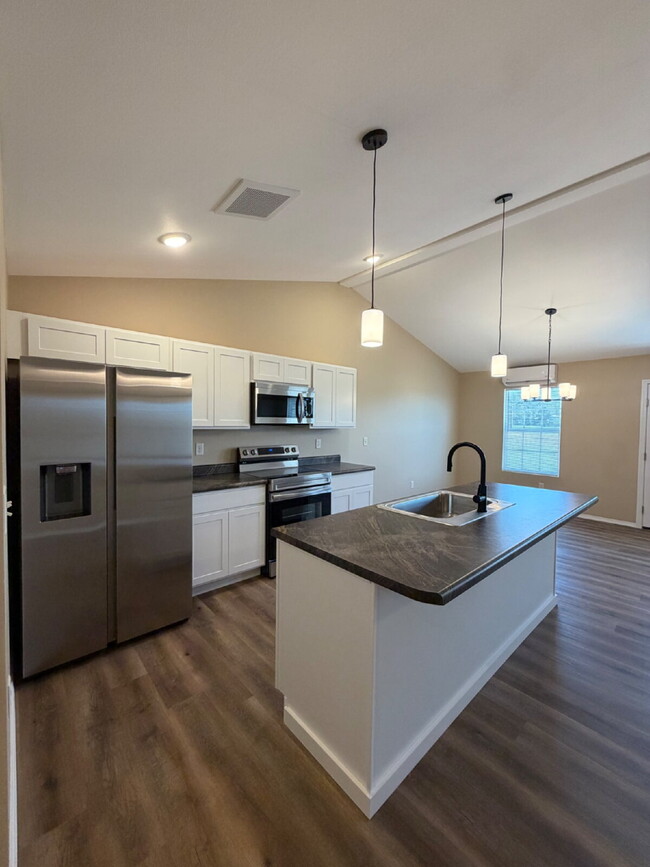 Building Photo - BRAND-NEW 4BR/2BA Duplex/Patio home with Garage - Available Now near Hollister, Schools