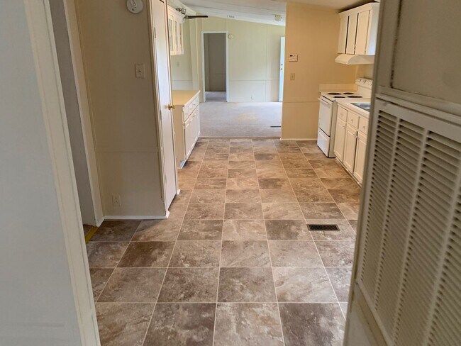 Building Photo - Doublewide Mobile Home on Large Corner Lot