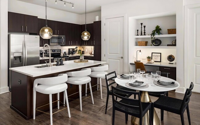 Counter on both sides of the electric range gives prep space to work. - Tens on West