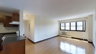 Located at 300 Tresser Blvd in downtown Stamford, Connecticut, this 2-bedroom, 1-bathroom residence offers a well-organized single-floor layout designed for comfortable everyday living. The living area is bright and open, showcasing gleaming hardwood floors that reflect natural light streaming in through large windows. The clean white walls and smooth ceilings contribute to an airy, uncluttered atmosphere throughout the space. A wall-mounted air conditioning unit and baseboard heating ensure year-round climate comfort. The open flow from the living area leads to a functional hallway connecting the bedrooms and bathroom, providing a logical and efficient floor plan. The kitchen is positioned adjacent to the living space, making it convenient for both cooking and entertaining. The overall aesthetic is clean and minimal, offering a neutral canvas that can easily be personalized. With its prime location in Stamford's urban core, this residence provides easy access to local amenities, transit, and the vibrant offerings of downtown Stamford, making it a practical and well-situated home.
