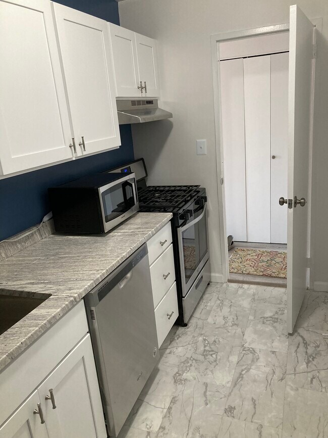 Kitchen With Door - 1330 New Hampshire Ave NW