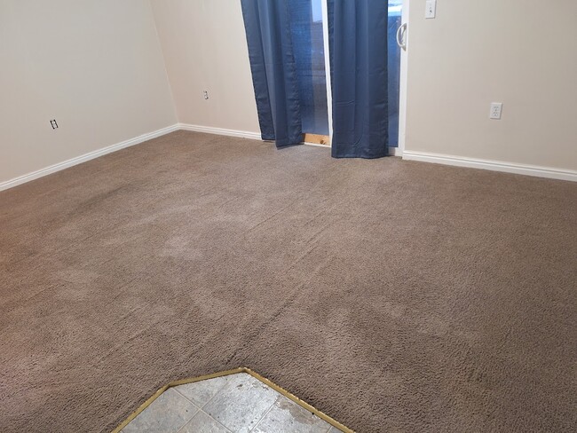 Living room with back porch area. - 3314 E South Ridge Rd