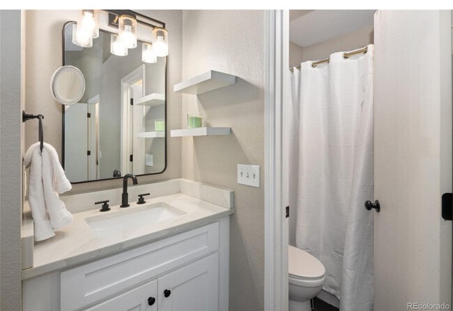 Bedroom1 bath - 10587 W Maplewood Dr Townhome