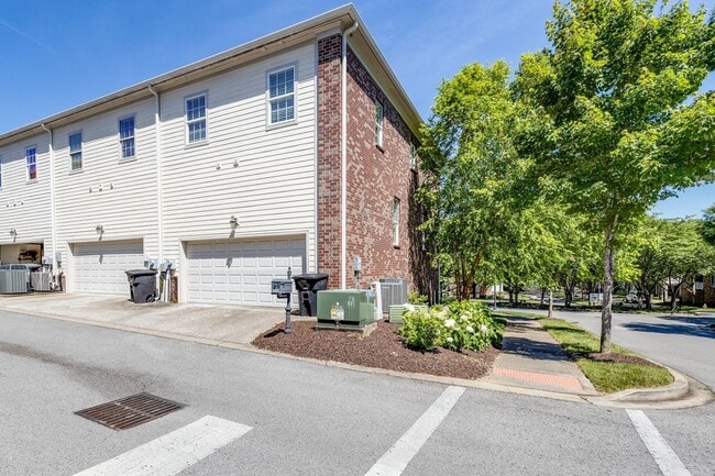 Building Photo - Welcome to this charming end unit townhome