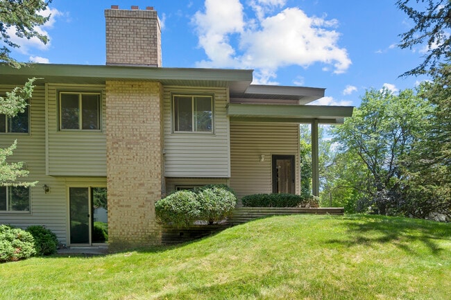 Corner unit, private yard, porch, MF exterior, WO lower level, new concrete, 2 stall attached garage - 9774 Dorset Ln