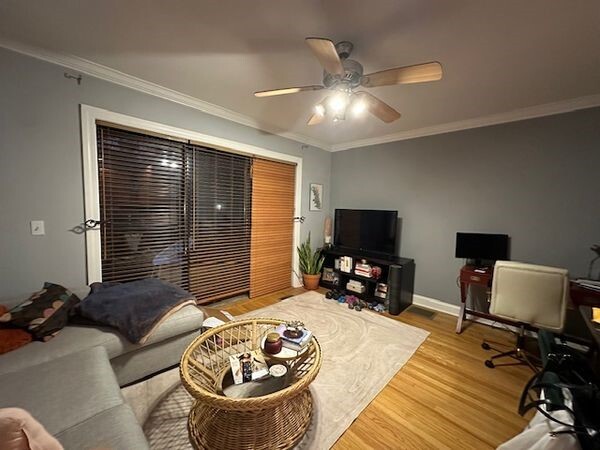 Living Room; Glass sliding door leads to balcony - 1157 W Grace St