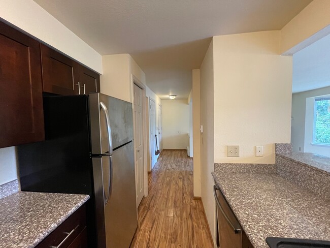 your pantry and kitchen view to the entry - 280 NW Holly St