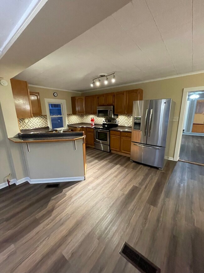 full kitchen with fridge, stove, microwave, and dishwasher - 2310 Old Berwick Rd