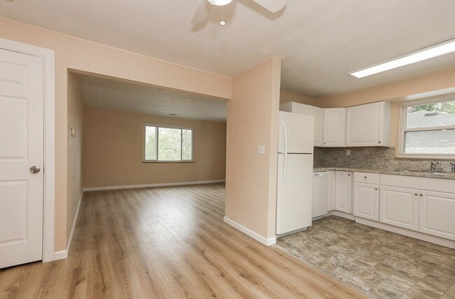 In dinning looking into the kitchen and living room - 390 E Lake Ave