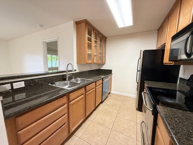 Building Photo - Resort-Style 2BR/2BA First-Floor Condo in Gated Lucera Community Near UTC