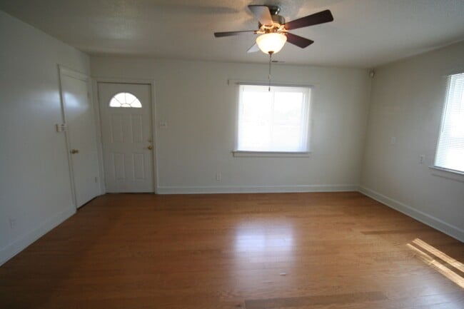 Photo - Two bedrooms, hardwood throughout, and a private driveway — all under $1,400 near Duke West. Apartment