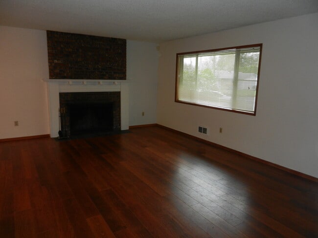 Photo - Well-Located Home with Fireplace, Fenced Yard & 2-Car Garage
