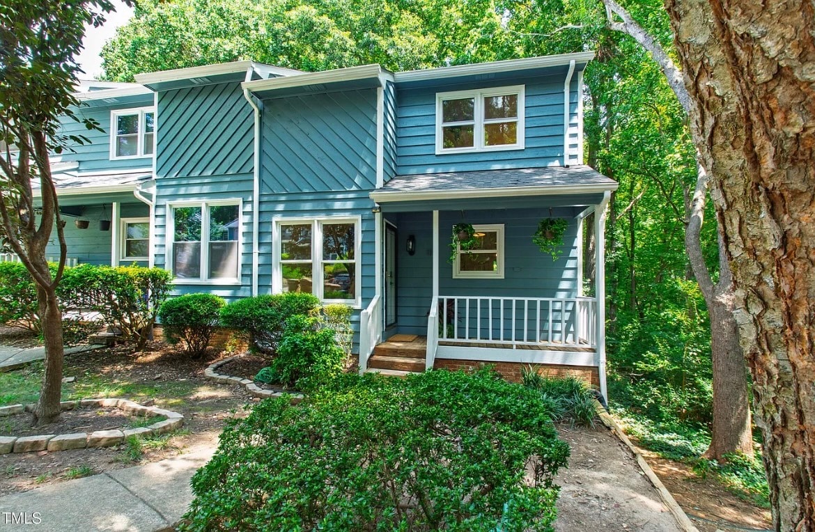 Front of townhouse. New exterior paint this year. Freshly power washed. - 115 Inverness Ct