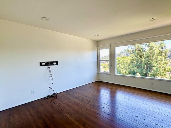 Integrated media wall with concealed wiring and pre-installed TV mount. - 1672 Rotary Dr