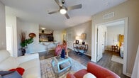 Located at 3814 Redan Rd in Decatur, GA, this single-story, 3-bedroom, 2-bathroom home offers a functional and modern living experience. The open-concept layout seamlessly connects the living room, dining area, and kitchen, creating a cohesive and inviting shared space. The living room features wood-look flooring, a ceiling fan, and large double doors that invite natural light, lending the area a bright and airy feel. Adjacent to the living room, the dedicated dining area provides an intimate setting with neutral walls that complement the warm-toned furnishings. The kitchen is equipped with dark espresso cabinetry, granite-style countertops, black appliances including a refrigerator and range, and a breakfast bar with seating — ideal for casual dining. A pantry and dedicated laundry area add practical convenience. A wide hallway connects the three bedrooms, each offering wood-look flooring and ample closet space, with a total of three closets throughout the home. The primary bedroom is generously sized, while the additional bedrooms are well-suited for guests or a home office. Both bathrooms feature dark vanity cabinetry and tub-shower combinations. Throughout, neutral tones and consistent flooring create a cohesive, move-in-ready aesthetic.