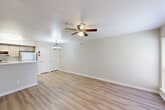 Located at Borough Park Drive in Spring, TX, this one-bedroom, one-bathroom unit offers a well-designed single-floor layout that maximizes every square foot of its compact footprint. The open-concept living, dining, and kitchen area forms the heart of the home, bathed in natural light from large windows dressed with blinds. Light wood-style laminate flooring runs throughout the main living areas, complemented by neutral wall tones that create a clean, welcoming atmosphere. Ceiling fans in the living area add both style and function.

The kitchen is equipped with stainless steel appliances — including a refrigerator, electric range, and microwave — and features light wood cabinetry with ample storage, white countertops, and a peninsula that doubles as a breakfast bar. A pantry and utility room provide additional storage and convenience.

The bedroom is carpeted for comfort, receives natural light through a window, and offers a cozy, well-proportioned retreat. The bathroom includes a full tub-shower combo, a wood-toned vanity, and hardwood-style flooring. Two closets and a dedicated laundry area round out the practical offerings of this efficiently designed home.