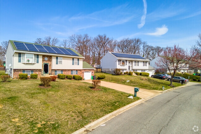 Many Temple Hills homes feature large driveways and garages.