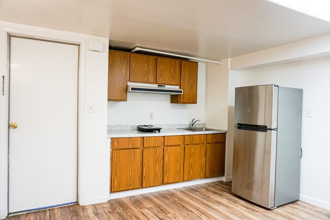 Kitchen with electric hot plate for simple home cooking, brand new fridge - 38 San Gabriel Ave