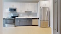 Located at 121 N 2nd St in Philadelphia's historic Old City neighborhood, this 570 square foot, one-bedroom, one-bathroom apartment offers a modern and efficient single-floor layout. The kitchen is a standout feature, outfitted with two-tone cabinetry — crisp white upper cabinets paired with gray lower cabinets — white quartz countertops, a subway tile backsplash, and a full suite of stainless steel appliances including a range, microwave, dishwasher, and refrigerator. Light wood-style flooring runs throughout the main living areas, contributing to the unit's clean, contemporary aesthetic. The 110 square foot bedroom is a quiet, neutral-toned room with light-colored walls, hardwood-style flooring, and a window that provides natural light. A dedicated closet with built-in shelving offers practical storage. The bathroom features large-format gray tile flooring, a gray vanity with a white countertop, and a full soaking tub with a shower combination enclosed by crisp white surround walls. Recessed lighting throughout the unit enhances the bright, open atmosphere. This well-designed apartment combines functional urban living with modern finishes in one of Philadelphia's most walkable and vibrant neighborhoods.