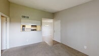 Located at 5915 Flintlock Rd in Houston, TX, this well-laid-out one-bedroom, one-bathroom unit offers a comfortable and functional living experience across a single floor. The living room is carpeted and bathed in natural light, highlighted by a sliding glass door that opens to a private balcony with a wooden railing — ideal for enjoying outdoor views. The adjoining dining area features light wood-tone flooring, a decorative chair rail, and an elegant multi-bulb chandelier, lending the space a refined yet approachable character. The kitchen is equipped with white cabinetry, granite-style countertops, and a stainless steel refrigerator, complemented by the same wood-tone flooring that flows through the dining area. The generously sized bedroom includes plush carpet, a ceiling fan with a light fixture, and a window that brings in soft, natural light from the surrounding greenery. A walk-in closet with built-in shelving provides ample storage. The bathroom features a full tub-shower combo with white tile surround, a toilet, and wood-look flooring. Throughout, the unit maintains a clean, neutral palette that creates a calm and inviting atmosphere.