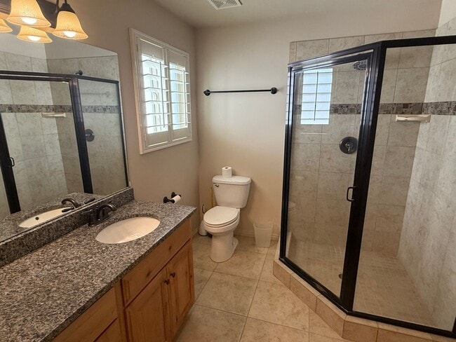 Building Photo - Beautiful patio home with 2 car garage, central air, fenced yard and covered patio