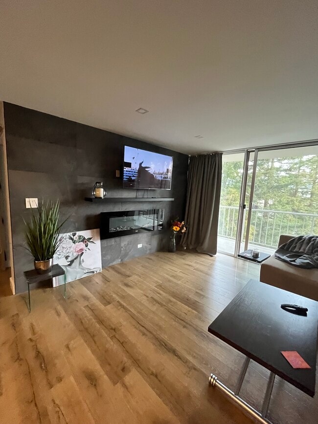 Living room with electric fireplace - 1 Kelton Ct