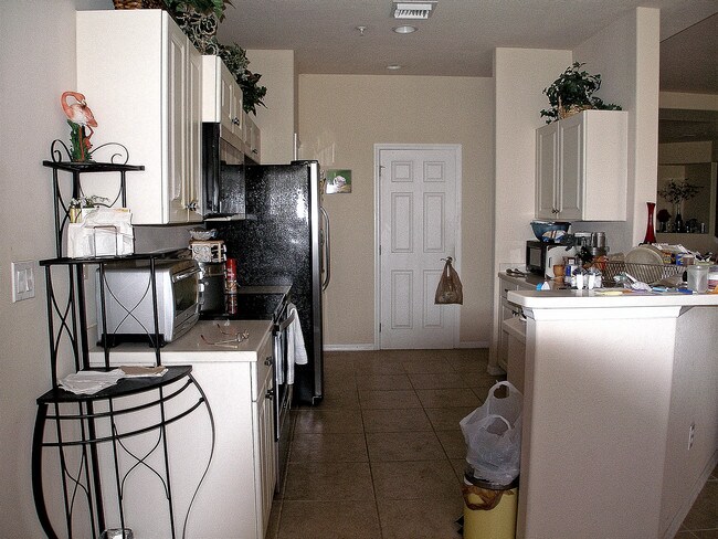 kitchen with washer/dryer closet - 12870 Carrington Cir