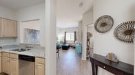 Located at 415 S Mesa Hills Dr in El Paso, TX, this 2-bedroom, 1-bathroom residence offers a thoughtfully designed single-floor layout that maximizes functionality and comfort. The open-concept living area flows naturally from the entryway, featuring light wood-style flooring, neutral walls, and a bright window dressed with patterned curtains that invite natural light into the space.

The kitchen is efficiently laid out in a U-shape configuration, showcasing light maple cabinetry, granite-look countertops, stainless steel appliances including a range and dishwasher, and a stainless steel refrigerator — providing ample storage and prep space for daily use.

The primary bedroom is generously sized, finished with plush carpet, a ceiling fan with light fixture, and a large window with blinds that provide natural light and privacy. A walk-in closet with built-in shelving rods offers practical storage. The shared bathroom is finished with granite countertops, light wood cabinetry, and a large vanity mirror, maintaining the cohesive aesthetic found throughout the home.

The second bedroom continues the same warm, carpeted comfort. Throughout the residence, the clean white walls, consistent finishes, and open sightlines create a bright, welcoming ambiance ideal for everyday living.