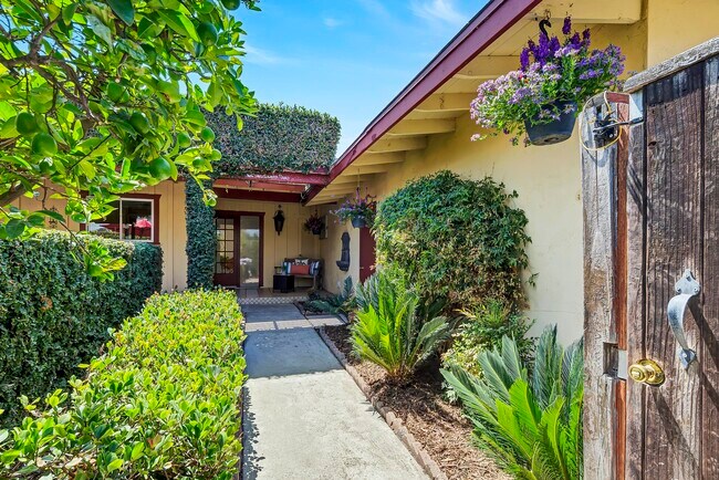 Private gated entry to courtyard garden and front patio. - 8055 Morocco Dr