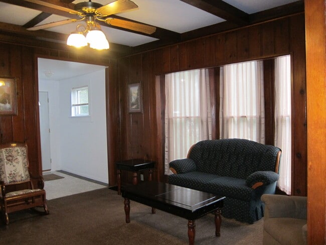 Family room has a nice bay window. Furniture not included. - 1445 South Center Street