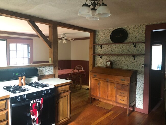 Spacious and charming eat-in country kitchen with new dishwasher, stove, fridge. - 11 Kellogg St