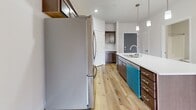 This well-designed 530 square foot apartment maximizes space efficiency while offering modern comforts. The single-floor layout includes a bedroom, bathroom, kitchen, and a closet. The primary bedroom, measuring 130 square feet, provides ample space and features plush carpeting and a large window for natural light. The bathroom boasts a contemporary design with a spacious vanity, large mirror, and wooden cabinets. The kitchen is a highlight, featuring stainless steel appliances, including a refrigerator and stove, complemented by sleek wooden cabinetry and light-colored countertops. The open-concept living area seamlessly connects to the kitchen, creating a sense of spaciousness. Throughout the apartment, neutral tones dominate, with white walls and warm wooden elements creating a cohesive, inviting atmosphere. Ceiling fans and baseboard heating ensure year-round comfort. The apartment's thoughtful design and modern amenities make it an ideal choice for those seeking a compact yet comfortable living space in Fitchburg, Wisconsin.