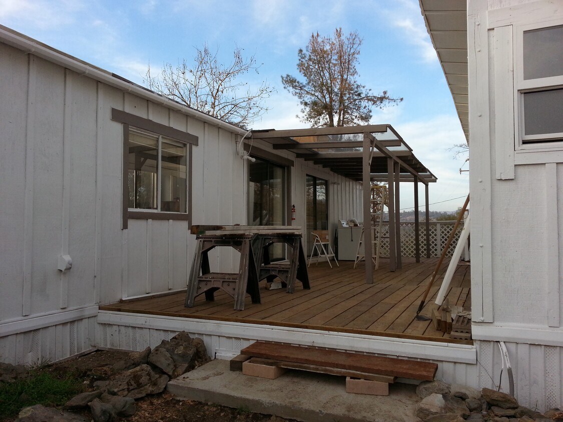 Large partially covered deck off kitchen - 33590 Rivercrest Rd N