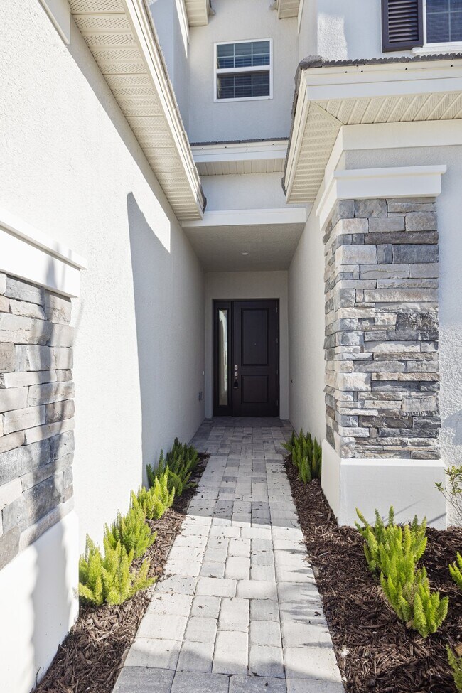 Building Photo - Luxurious gated community 5-Bedroom Rental with water view screen porch and Guest Suite on the fi...