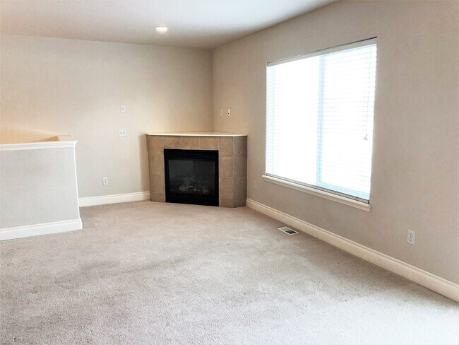 Living Room w/Gas Fireplace - 252 E 56th Ave