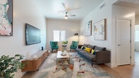 Located at 140 W Second Ave in Mesa, AZ, this thoughtfully designed one-bedroom, one-bathroom unit offers a well-planned single-level layout that maximizes every square foot. Light wood-look flooring flows throughout, complementing the clean, neutral palette and creating a cohesive modern aesthetic.

The combined kitchen and living area serves as the heart of the home. The kitchen features sleek slate-blue cabinetry, white quartz countertops, a stainless steel appliance suite including a dishwasher, microwave, and range, and a bright window that fills the space with natural light. The adjoining living area benefits from elevated ceilings, a ceiling fan, and ample room for comfortable furnishings.

A dedicated office provides a versatile secondary space with large windows that invite natural light and offer views of the surroundings — ideal for a home workspace or flex room. The bedroom is a calm, private retreat with a window and direct access to a walk-in closet outfitted with dual hanging rods and shelving on multiple walls. The full bathroom includes a shower/tub combination and continues the wood-look flooring found throughout the unit. A hallway connects the rooms efficiently, completing this well-organized and contemporary living space.
