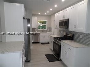 Building Photo - 6540 W 11th Ln