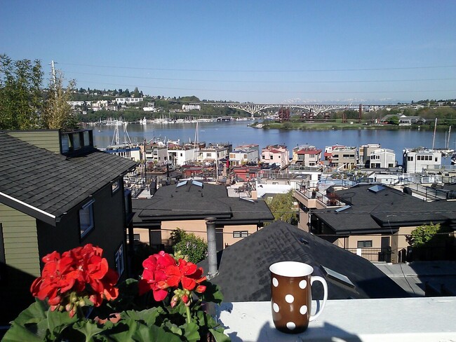 Morning coffee of the deck. Enjoy watching the sea planes, kyakers, and lots of other boat activity. - 2619 Yale Terrace E