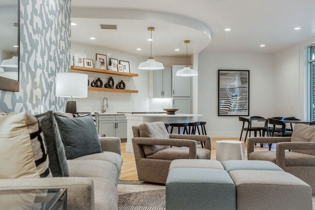 Modern Clubroom Featuring Kitchen, Lounge Chairs, and Dining Area - The Maggie