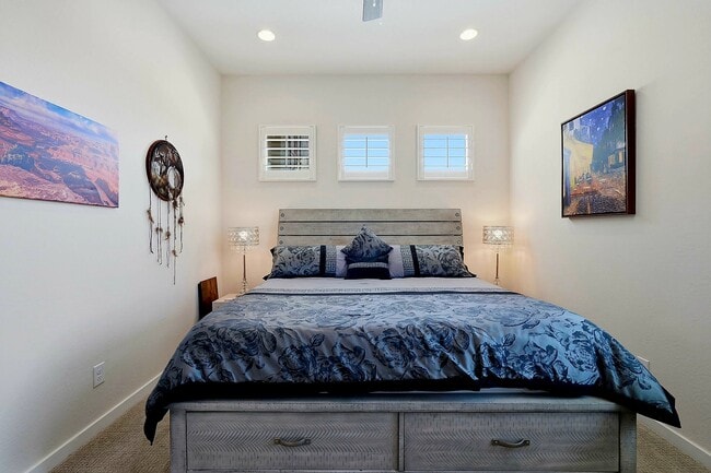 The King bed offers sound sleep, while a sofa bed in the lounge accommodates extra guests. - 22536 E San Tan Blvd