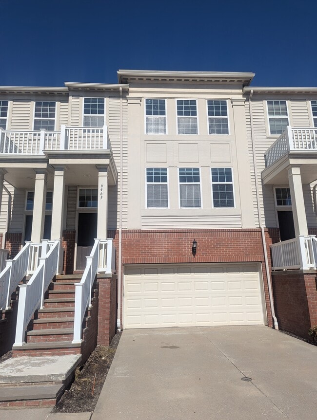 Front entrance with a two-car garage - 6465 Park Pointe Ct