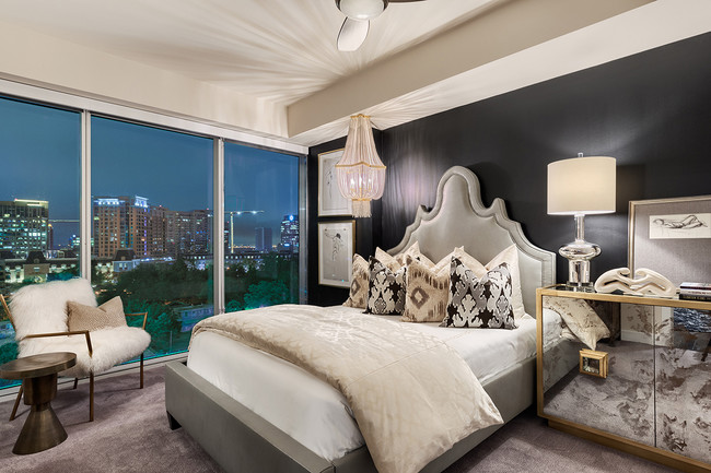 Modern bedrooms with expansive skyline views - One Uptown