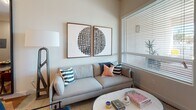 Located at 417 Centinela Ave in Inglewood, California, this one-bedroom, one-bathroom residence offers a thoughtfully designed single-floor layout that maximizes every inch of its compact footprint. Warm wood-style flooring flows consistently throughout, anchoring the space with a cohesive, modern aesthetic.

The kitchen is outfitted with a full suite of stainless steel appliances, including a refrigerator, electric range, dishwasher, and over-the-range microwave. Crisp white cabinetry extends to the ceiling, providing ample storage, while dark countertops offer a clean contrast. The open sightline from the kitchen into the dining area enhances the sense of connectivity between spaces.

The living area receives natural light through a generous window fitted with blinds, creating a bright and inviting atmosphere. The elevated ceiling height visible in the living zone adds a sense of openness beyond what the floor plan alone might suggest.

The bedroom is a serene retreat, featuring a sliding-door closet with built-in shelving and rod, a window that welcomes natural light, and sufficient space for a full seating area alongside the bed.

The bathroom is finished with wood-style flooring that carries through from the rest of the unit, paired with white cabinetry, dark countertops, and a well-lit vanity mirror. Clean, neutral walls throughout the unit create a versatile backdrop suited to a variety of interior styles.